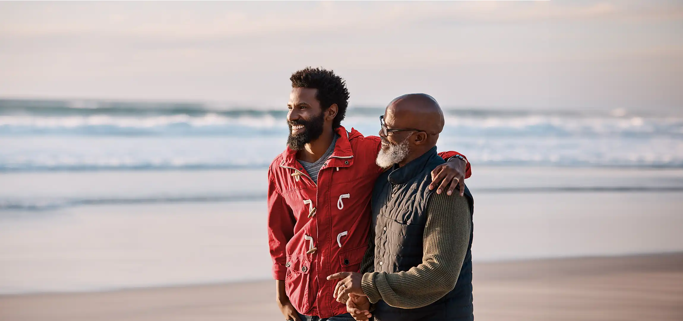 Father and Son walking on the beach and sharing a personal moment