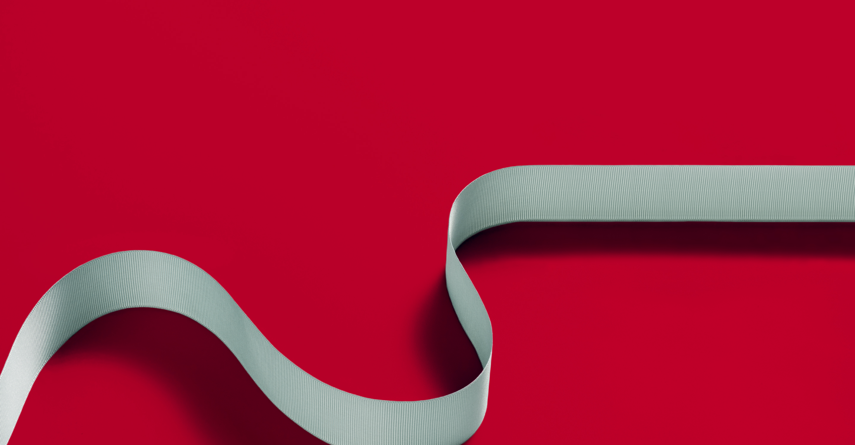 white ribbon on red background