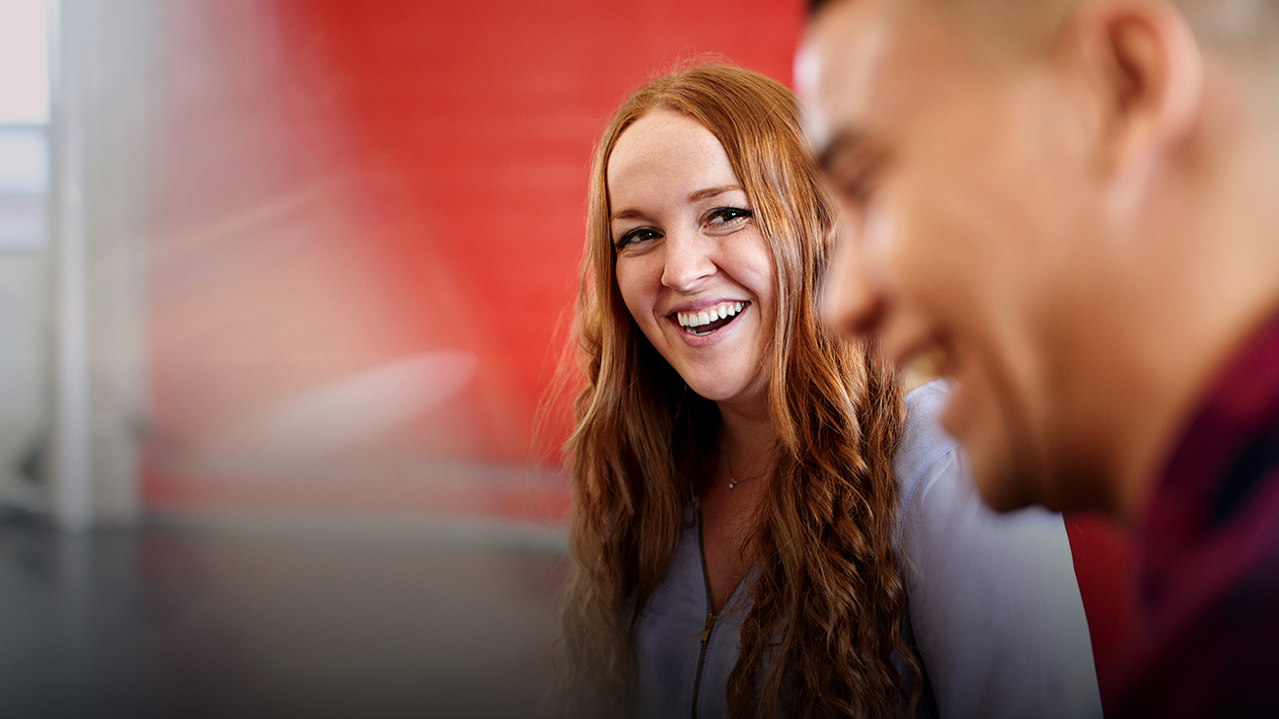 A man and woman enjoying a lighter moment at a meeting. Vanguard’s commitment to integrity and stewardship is based in large part on trust among crew.