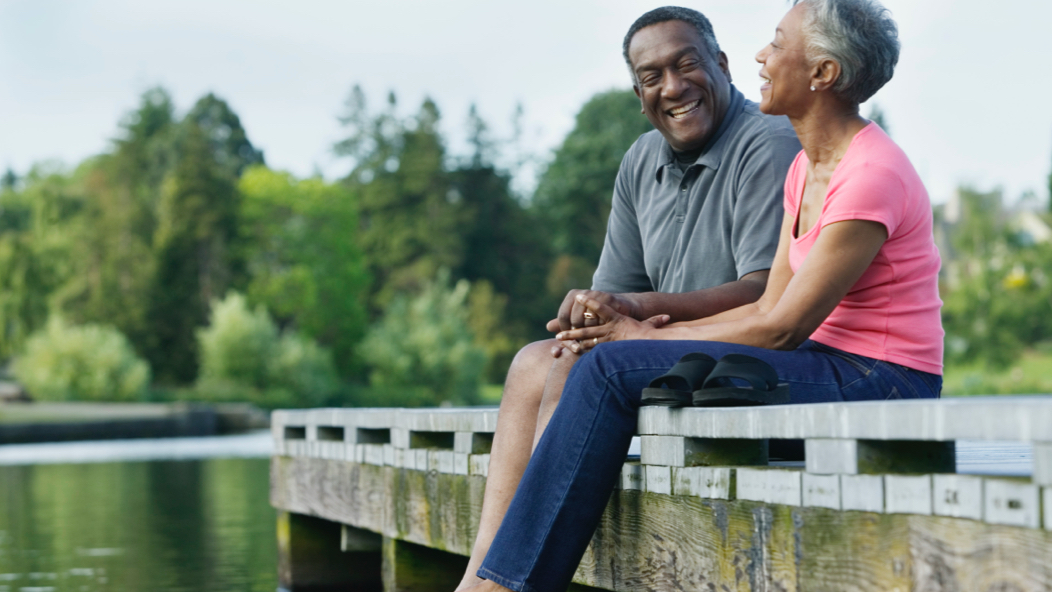 Vanguard offers a full suite of products and services to meet the diverse needs of retirees, including this couple enjoying a lighter moment outdoors.